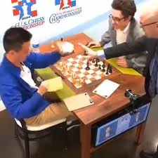 Chess grandmaster angrily punches female videographer after he lost to opponent