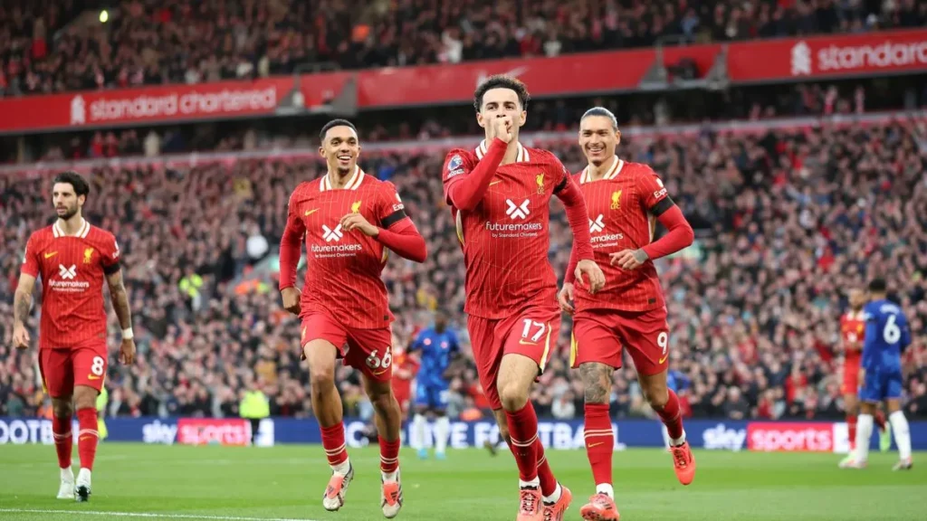 Liverpool beat Chelsea 2-1 to move top of the premier league table