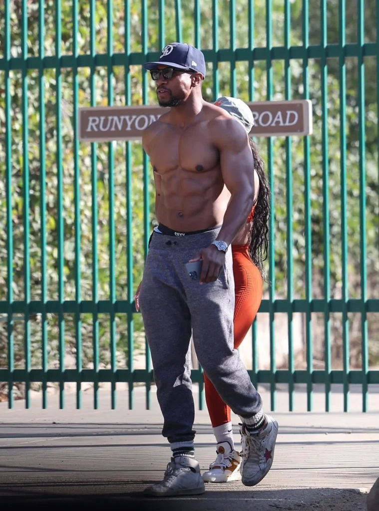 Jonathan Majors Flaunts Impressive Physique on Morning Walk with Fiancée Meagan Good